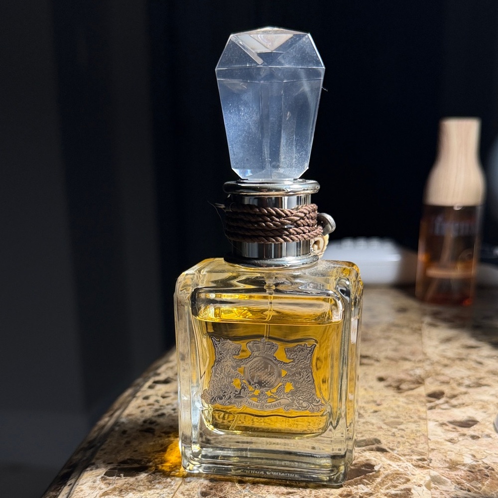 Juicy Couture perfume Parfum 1.7 ounces. Elegant Crystal-Top Perfume Bottle